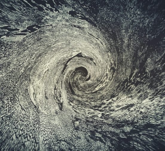 Abstract swirling pattern with dynamic motion effect, suitable for artistic backgrounds.